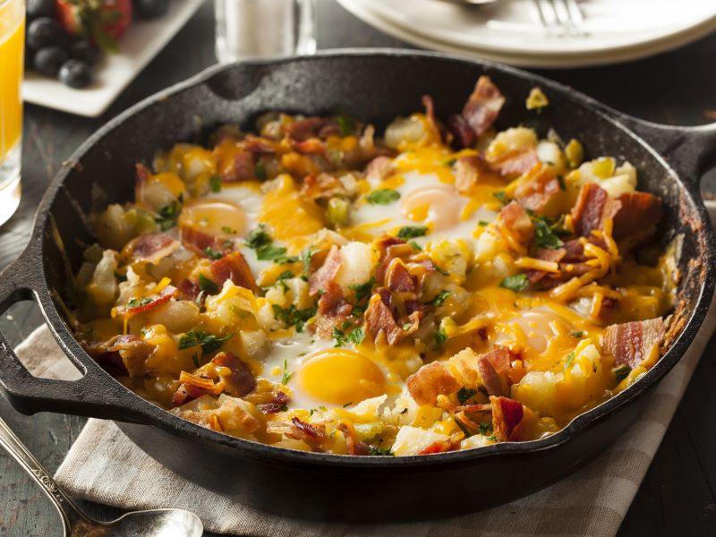 Grilled Breakfast Hash Skillet with eggs, potatoes, cheese, and bacon