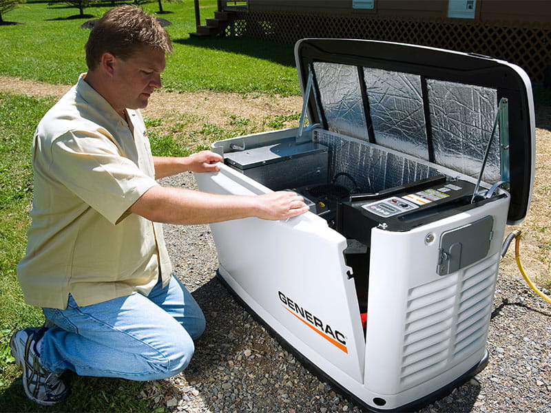 Person inspecting generator.