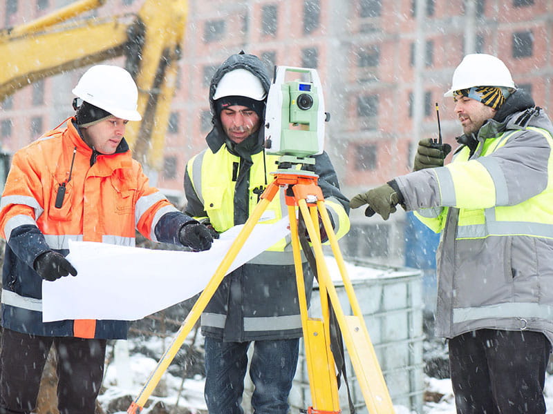 Construction crew looking at plans.