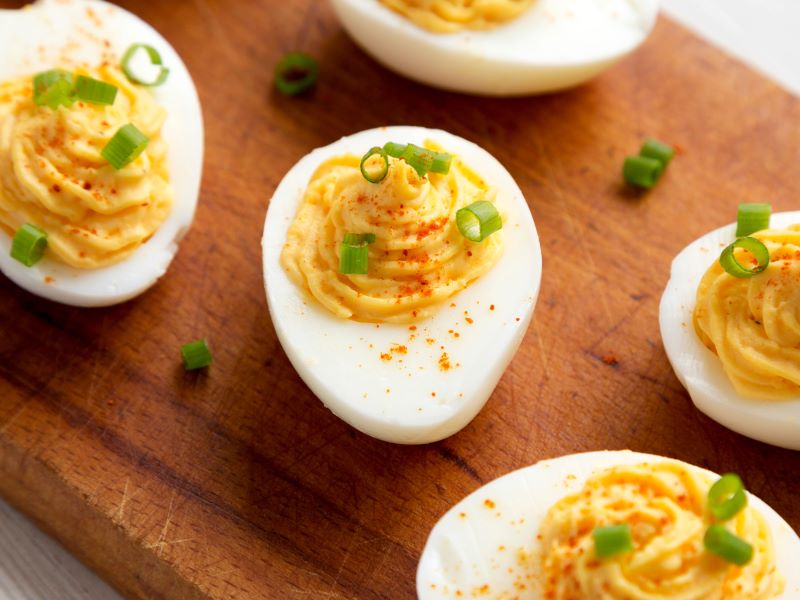 Deviled Eggs on Wooden Board