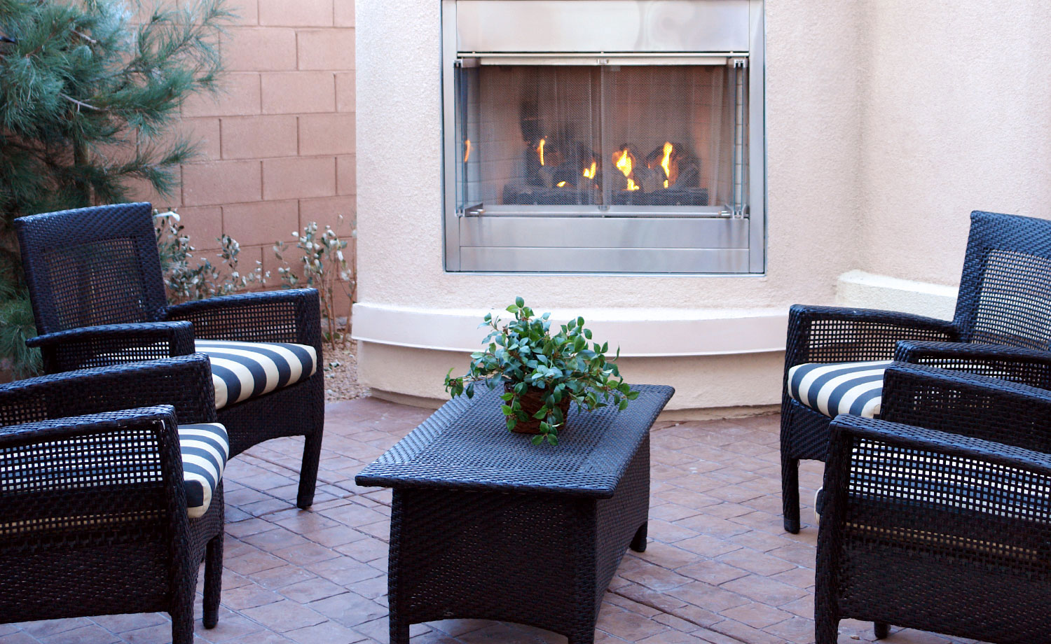 Outdoor seating area with fireplace.