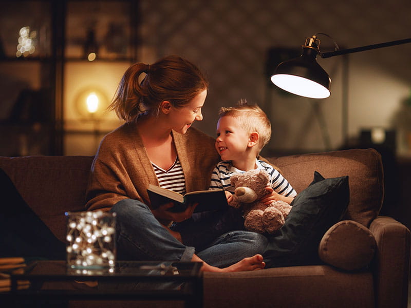 Woman reading to child.