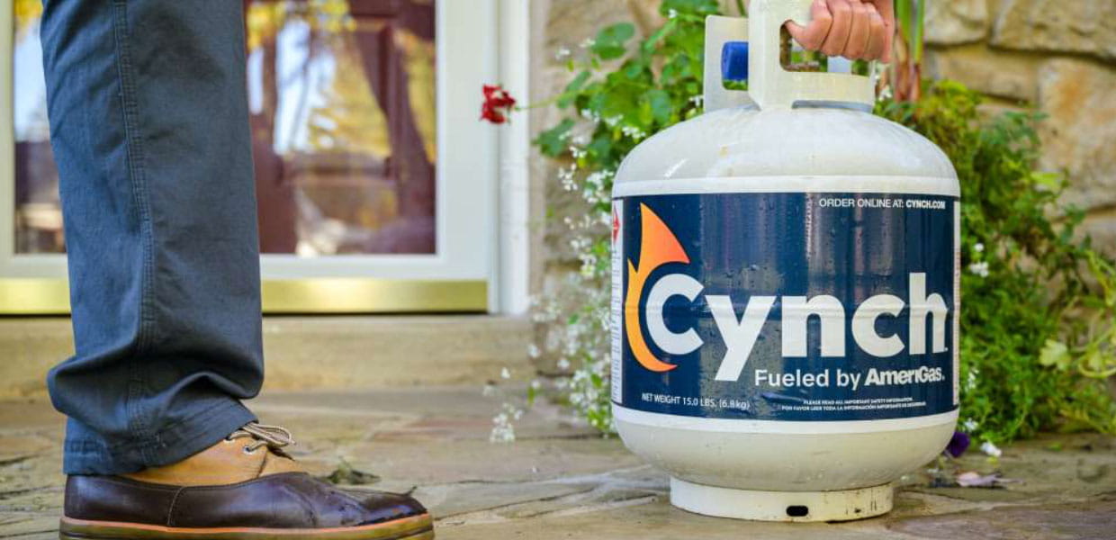 Cynch propane grill tank on a porch