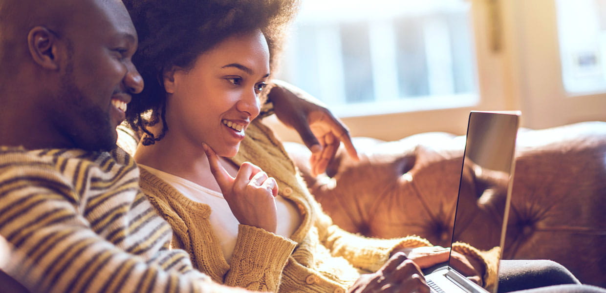 Man and woman looking at computer