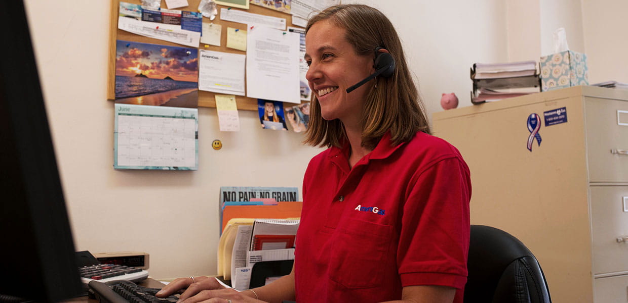 AmeriGas employee with headset on at computer